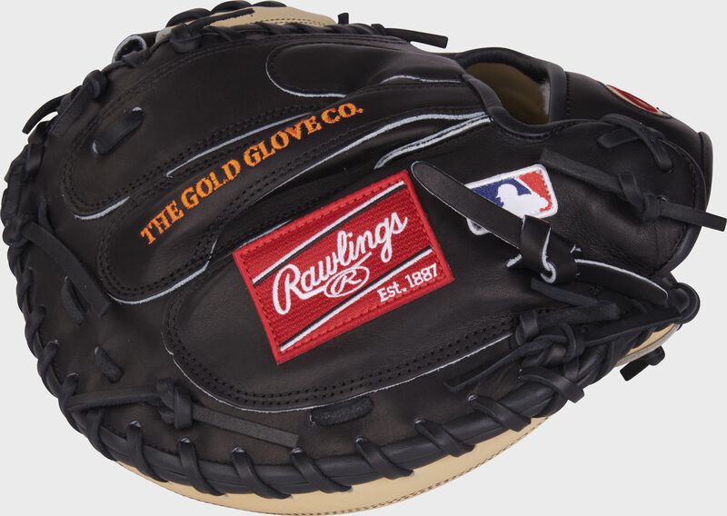 Black back of a Tucker Barnhart G57 catcher's mitt with a red Rawlings patch and MLB logo - SKU: RPROSCM33TB-RHT loading=