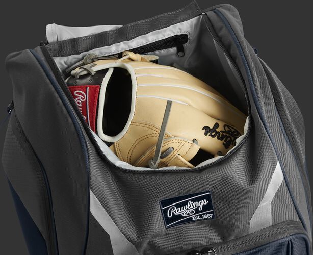 A glove in the dedicated glove storage pocket of a Rawlings Legion equipment backpack - SKU: LEGION-N