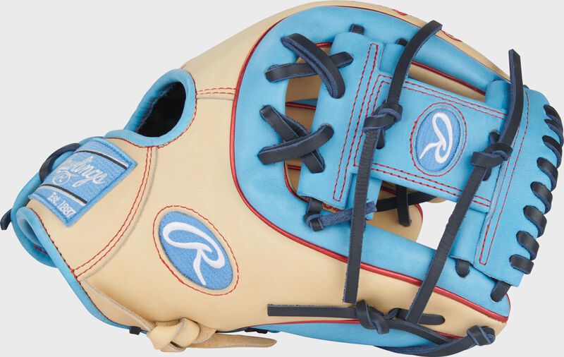Camel thumb of a Heart of the Hide 11.5-Inch Infield Glove with a Columbia blue Pro I-web