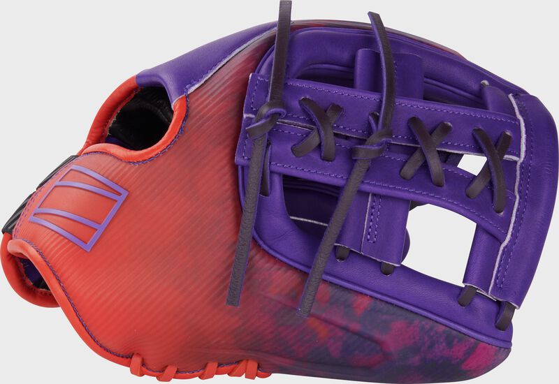 Thumb of a purple/orange Rawlings Francisco Lindor REV1X 11.75" infield glove with a purple split laced Single Post Web