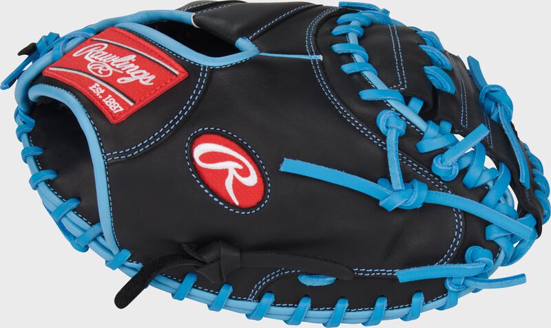 Black thumb of a R9 Series 32.5-Inch Catcher's Mitt with a red Rawlings Oval-R