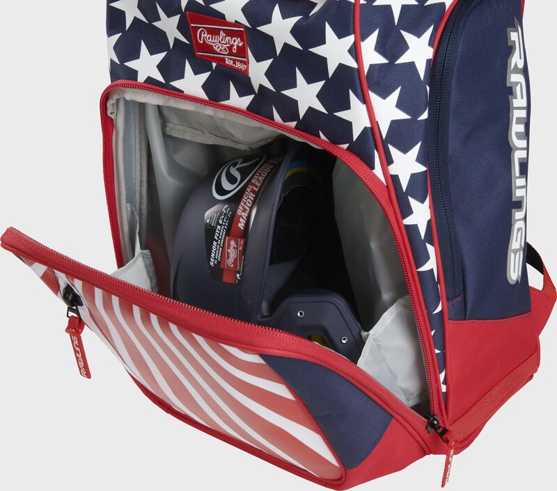 Angled view of red, white, and blue Rawlings Legion Backpack with helmet inside - SKU: LEGION loading=