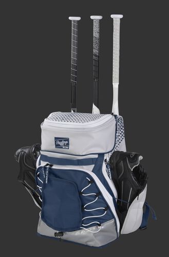 R800 Rawlings softball bag with a white/navy design and holding shoes and bats in the external storage compartments