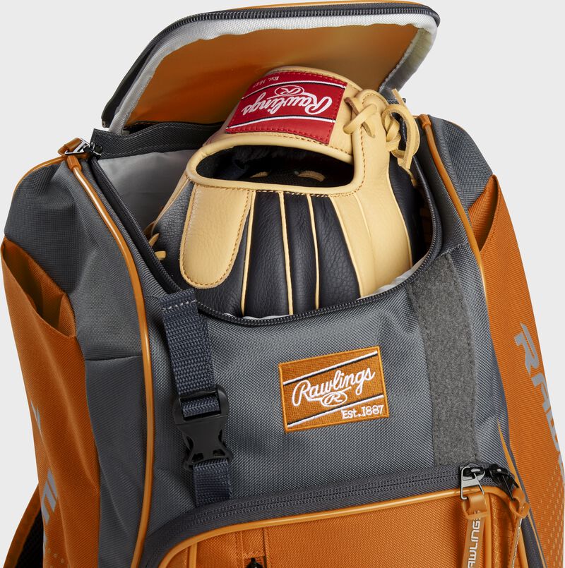 A Rawlings baseball glove in the top compartment of a Franchise baseball backpack - SKU: FRANBP-O