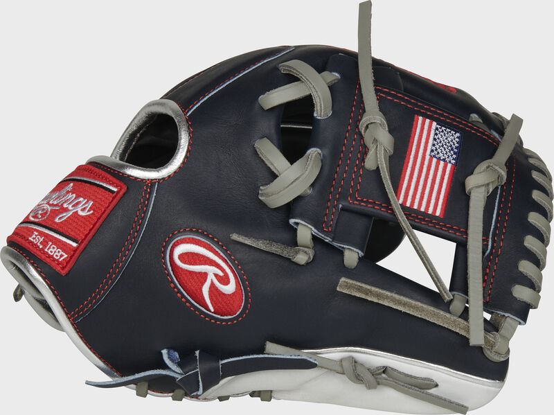 Thumb of a navy PRO204-2USA Heart of the Hide USA infield glove with a USA flag on the navy I-web