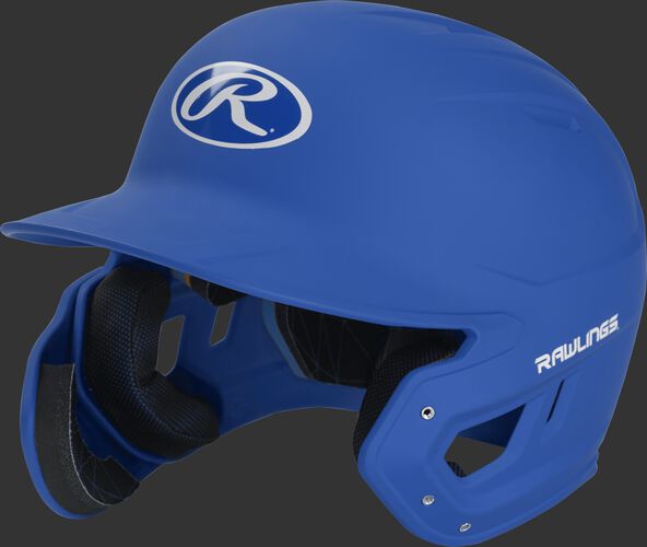 Left angle view of a MACHEXTL Rawlings Mach EXT Junior helmet with a one-tone matte royal shell
