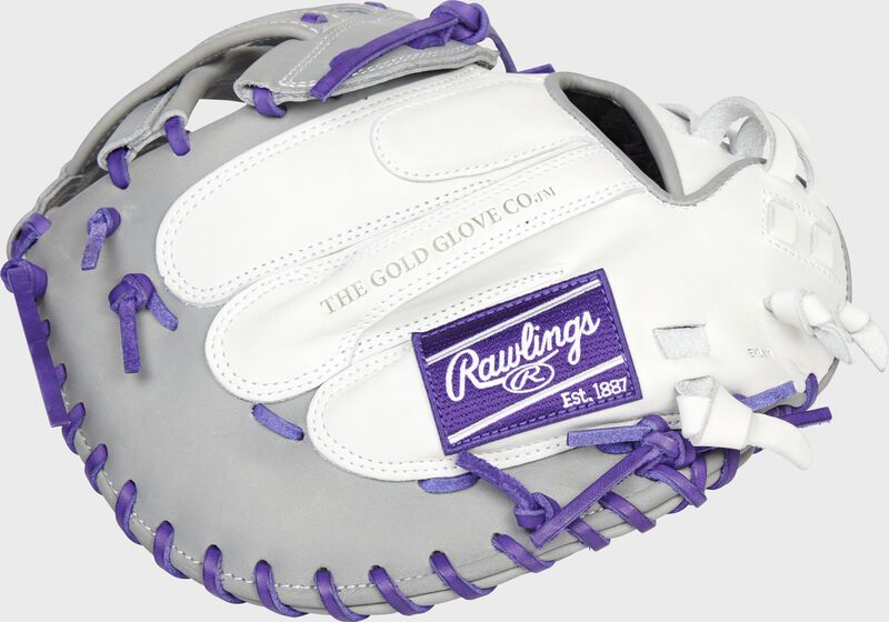 Back of a white/gray/purple 34-Inch Liberty Advanced Color Series catcher's mitt with a purple Rawlings patch - SKU: RLACM34FPWPG