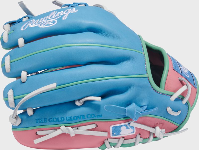 Back of a columbia blue/pink Exclusive Rawlings NXT Series 11.5" Infield Glove with the MLB logo on the pinky