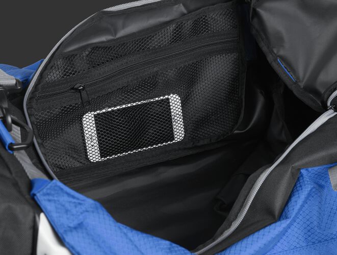 A phone inside the mesh accessory pocket inside the main compartment of a royal R601 Hybrid bag