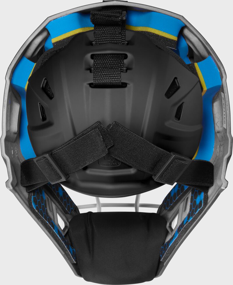 Back of a black Rawlings Mach Pro Series catcher's helmet loading=