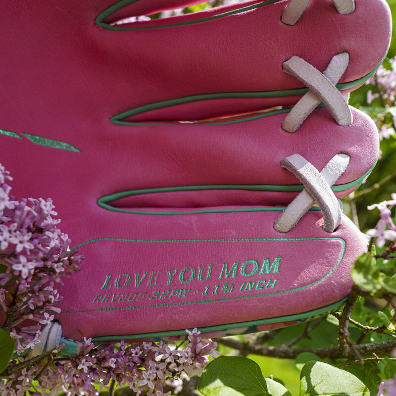 Picture of the pinky stamp that says "Love you Mom" on a Rawlings Race Day REV1X infield glove