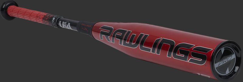 3/4 angle view of a red USZQ12 Quatro Pro -12 USA bat with a red/black grip and black end cap