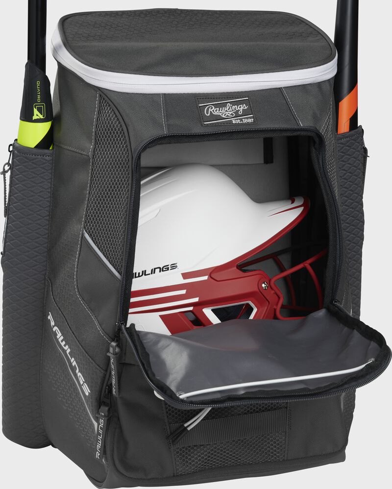 A graphite Impulse baseball backpack with a helmet in the main compartment - SKU: IMPLSE-GR