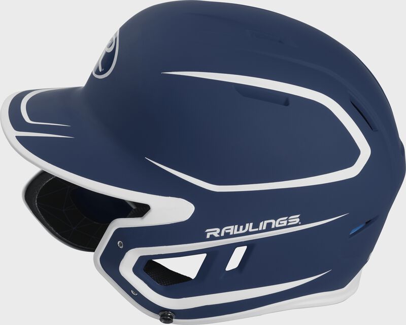Left side of a MACHEXTR junior Rawlings batting helmet with a two-tone matte navy/white shell