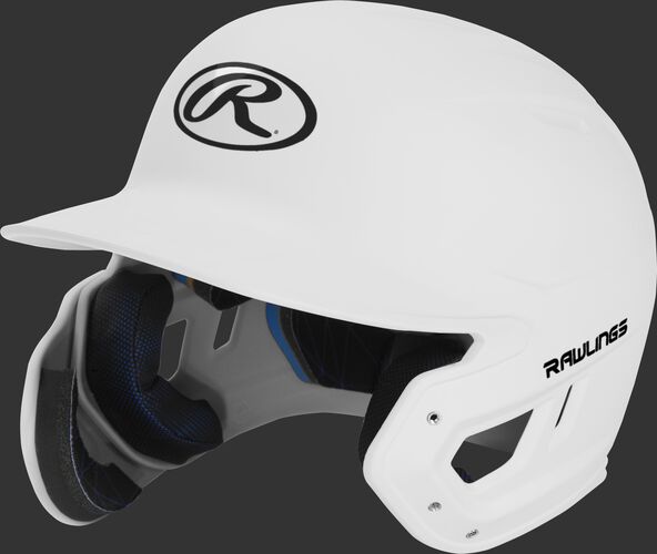 Left angle view of a MACHEXTL Rawlings Mach EXT Junior helmet with a one-tone matte white shell
