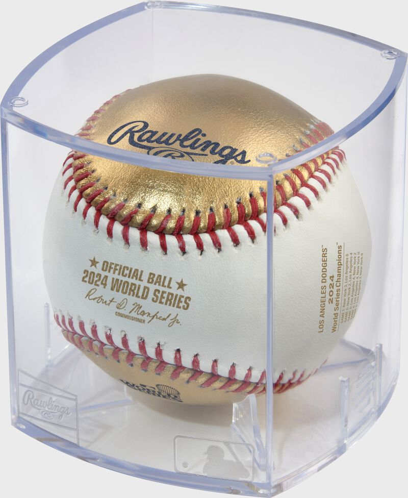 A gold/white 2024 World Series Champions baseball in a clear display cube