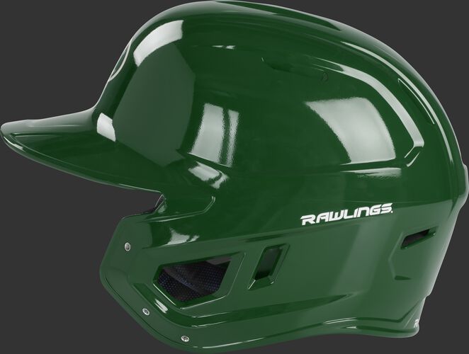 Left side of a dark green MCC01 Mach baseball helmet compatible with MEXT face guard extension