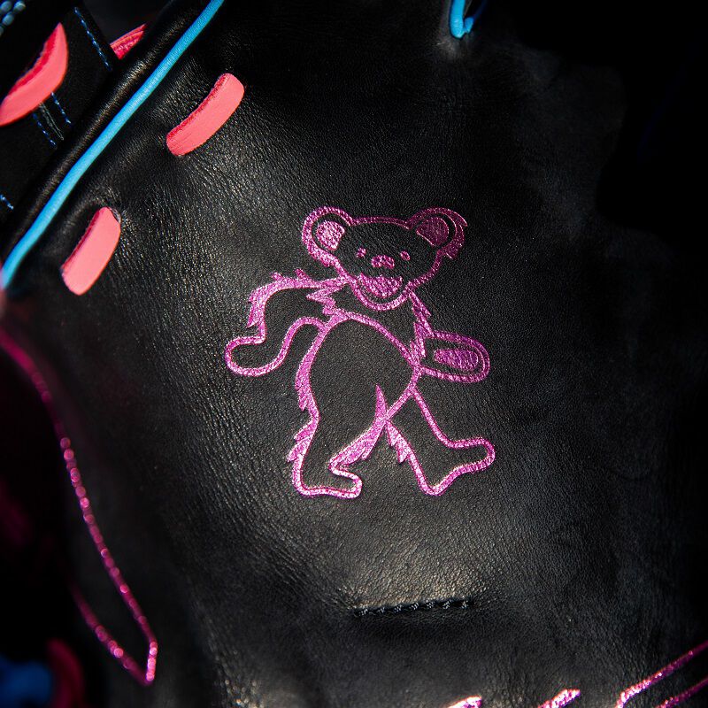 Picture of the purple bear stamp on the palm of a Rawlings Grateful Dead REV1X glove