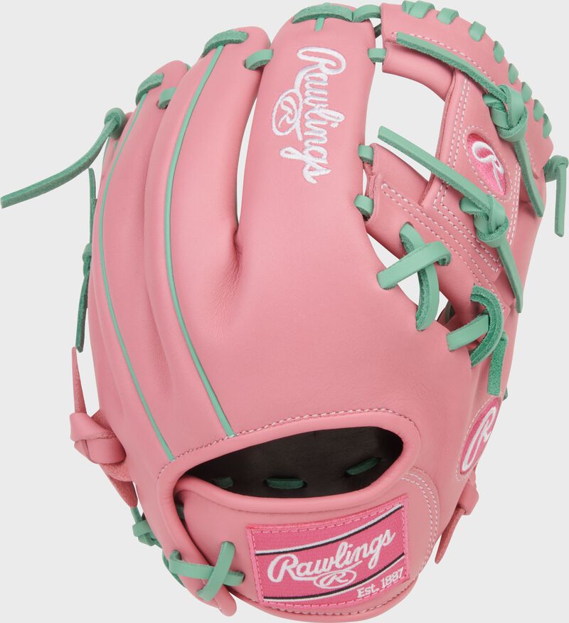 Pink back of a Rawlings NXT Series 11.5-Inch Pink Infield Glove with a pink Rawlings patch loading=