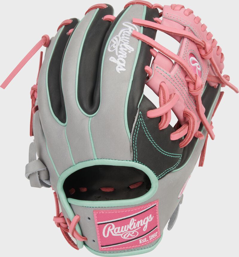 Gray/dark shadow back of a Rawlings Heart of the Hide 11.5-Inch Infield Glove with a pink Rawlings patch