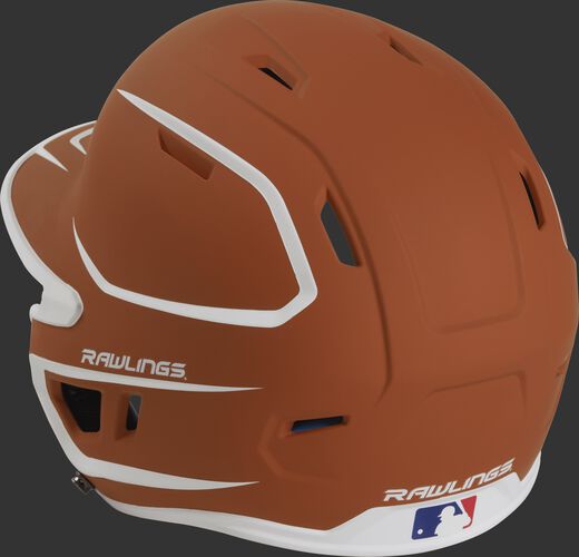 Back left view of a matte orange/white MACH series batting helmet with air vents