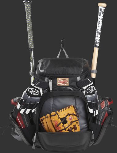 Front compartment of a black R1000 Rawlings Gold Glove Series backpack with a glove and batting gloves