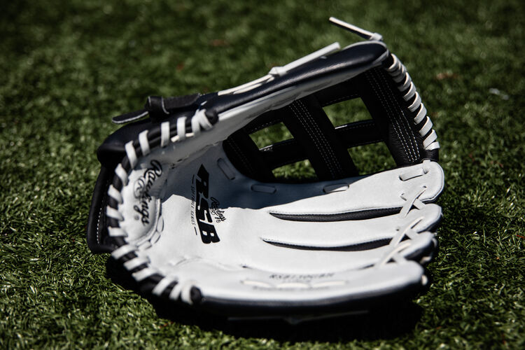 Grey palm of a Rawlings RSB recreational softball glove lying on a field - SKU: RSB130GBH