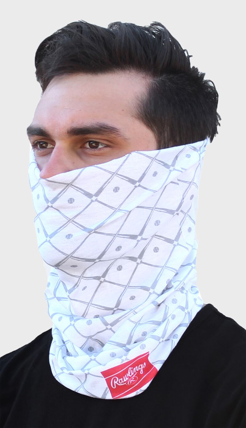 A guy wearing a white Rawlings adult multi-functional head and face cover around his mouth and nose - SKU: RC40005-100