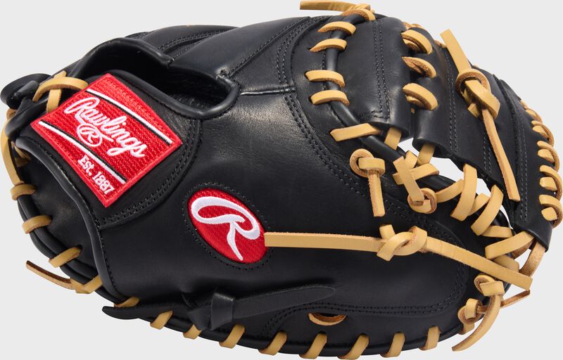 Black thumb of a Rawlings R9 ContoUR 32-Inch Catcher's Mitt with a red Oval-R and camel laces
