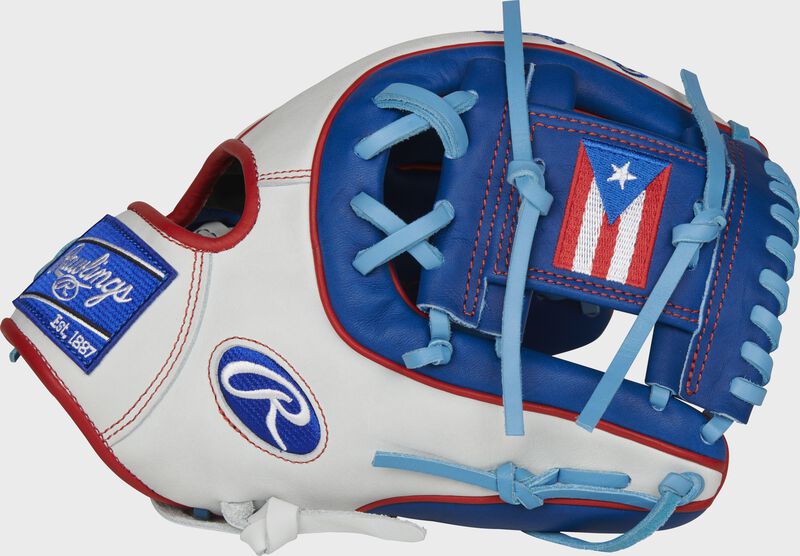 Thumb of a white/royal PRO314-2PR Heart of the Hide Puerto Rico infield glove with a PR flag on the royal I-web