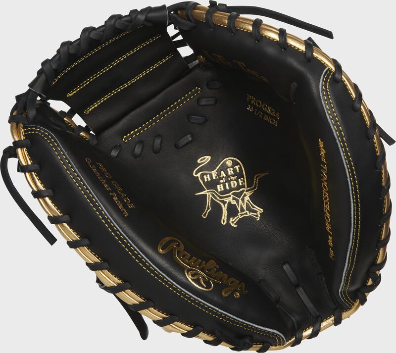Black palm of a Rawlings Heart of the Hide catcher's mitt with gold palm stamp and black laces - SKU: PROGS24