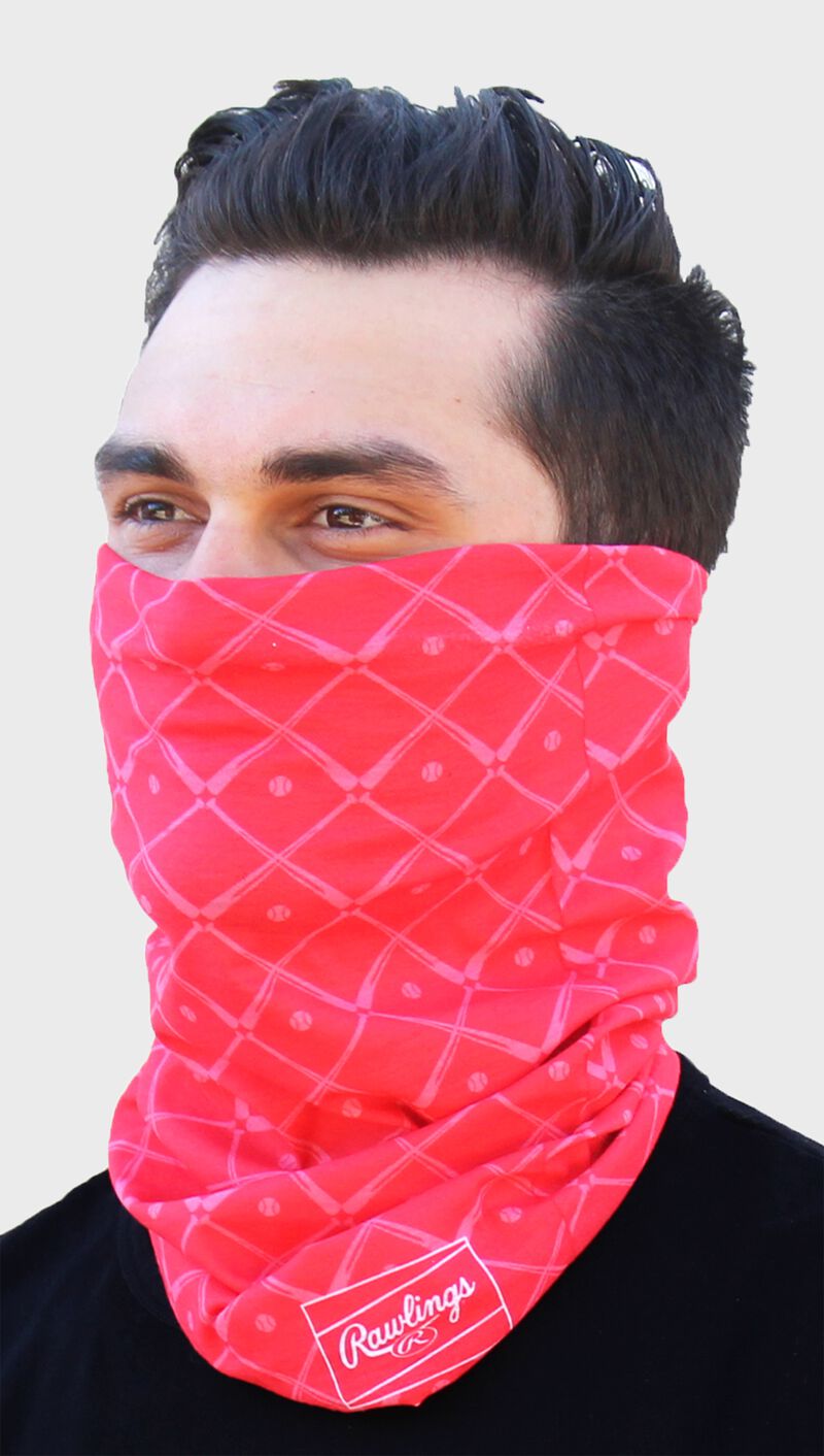 A guy wearing a red Rawlings adult multi-functional head and face cover around his mouth and nose - SKU: RC40005-600