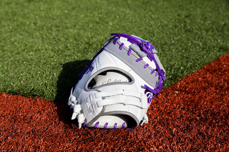 Back of a Liberty Advanced Color Series 13-inch first base mitt on a field - SKU: RLADCTSBWPG