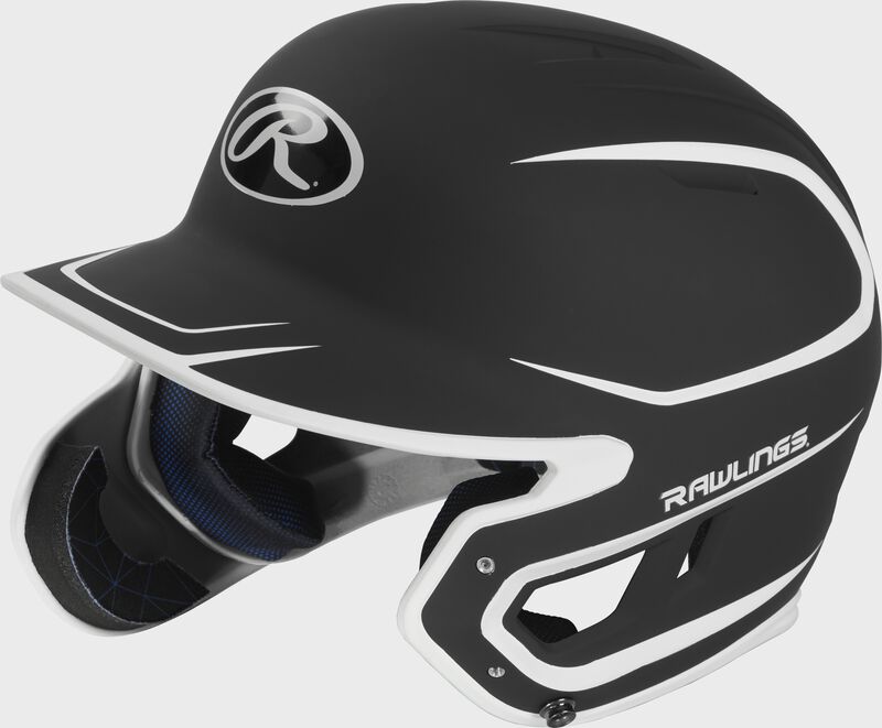 Left angle view of a MACHEXTR Rawlings Mach EXT Junior helmet with a two-tone matte black/white shell