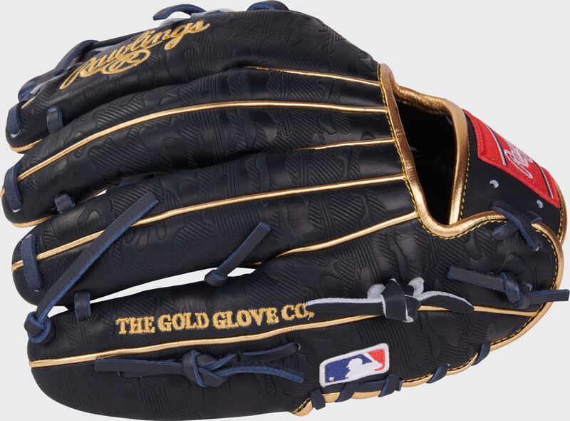 Navy back of an Anthony Volpe Heart of the Hide Infield Glove with gold accents and MLB logo on the pinky