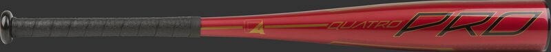 Barrel of a red UTZQ11 2020 Quatro Pro USSSA bat with black/gold accents