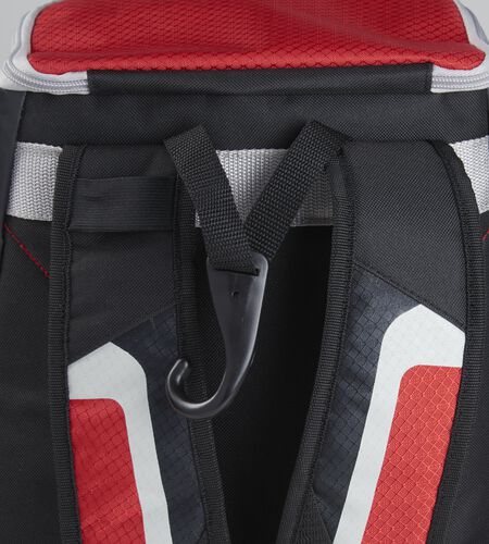 Exterior handle on the back of a black/scarlet R500 backpack with a hook for hanging it up