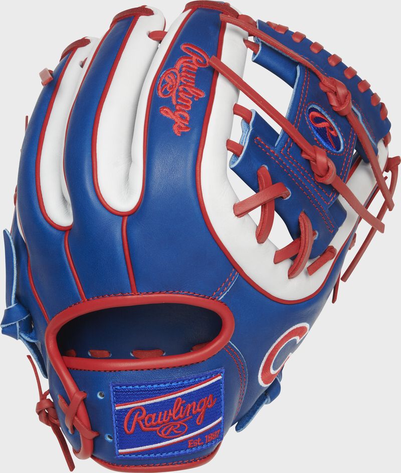 Shell back view of royal, white, and scarlet 2021 Chicago Cubs Heart of the Hide glove loading=