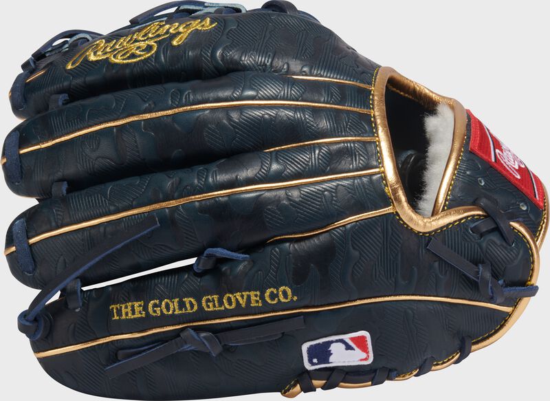 Navy geo-print leather back of a Gameday 57 Series Anthony Volpe Pro Preferred glove with the MLB logo on the pinky