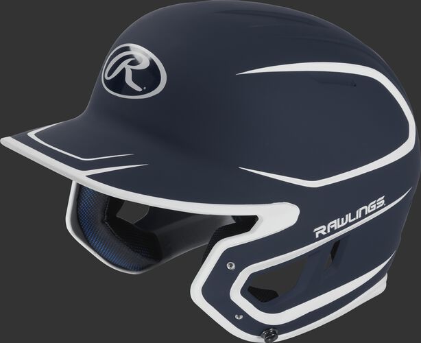 Left angle view of a Rawlings MACH Junior helmet with a two-tone matte navy/white shell