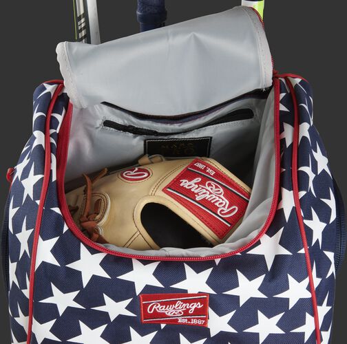 A glove in the dedicated glove storage pocket of a Rawlings Legion equipment backpack - SKU: LEGION-USA
