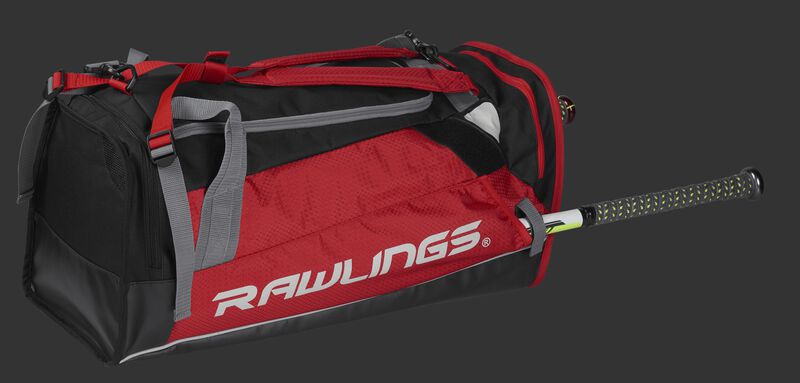 Side angle view of a scarlet R601 Rawlings Hybrid backpack/duffel bag with a bat in the side compartment