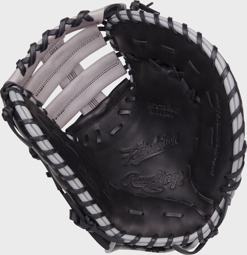 Black palm of a Rawlings Foundation Series youth first base mitt with black laces - SKU: RSGRFDCT8-10B