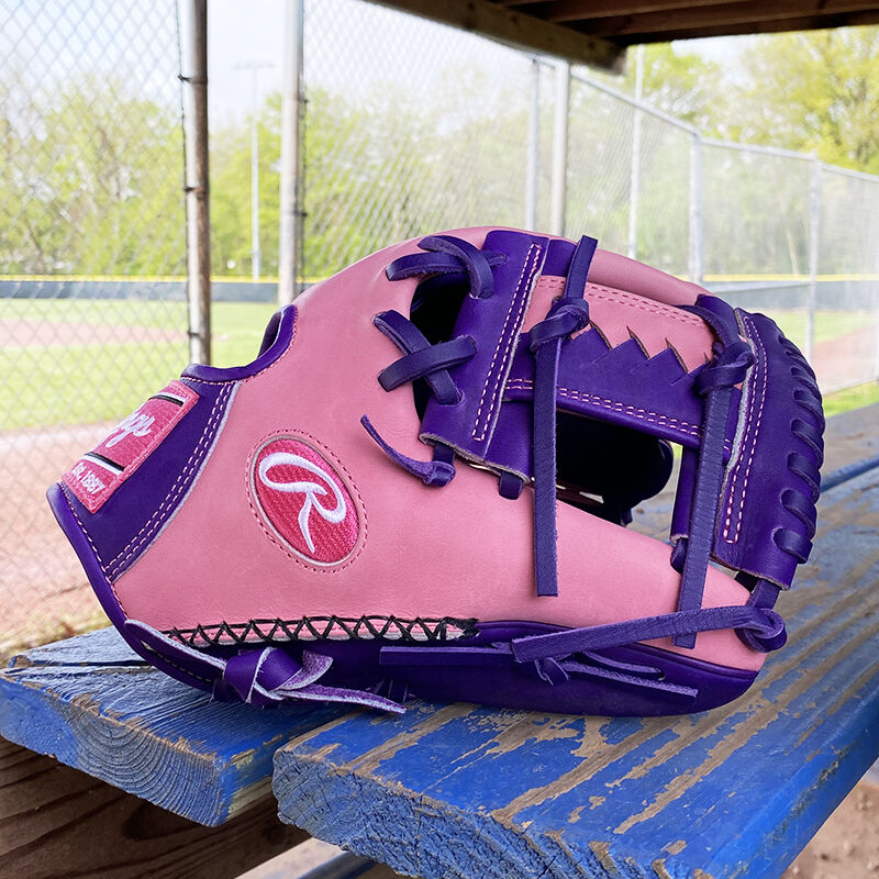Picture of the thumb of a Rawlings exclusive 11.5" R2G Heart of the Hide pink/purple infield glove on a table