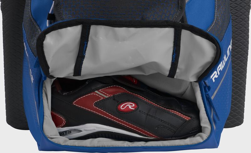 A royal Rawlings baseball backpack with a cleat in the bottom cleat storage compartment - SKU: IMPSLE-R