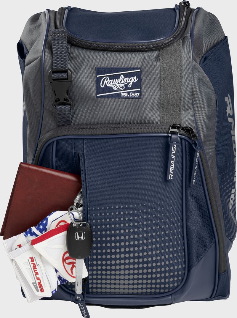 Wallet, keys, and batting gloves in the front valuables pocket of a navy Franchise baseball bag - SKU: FRANBP-N
