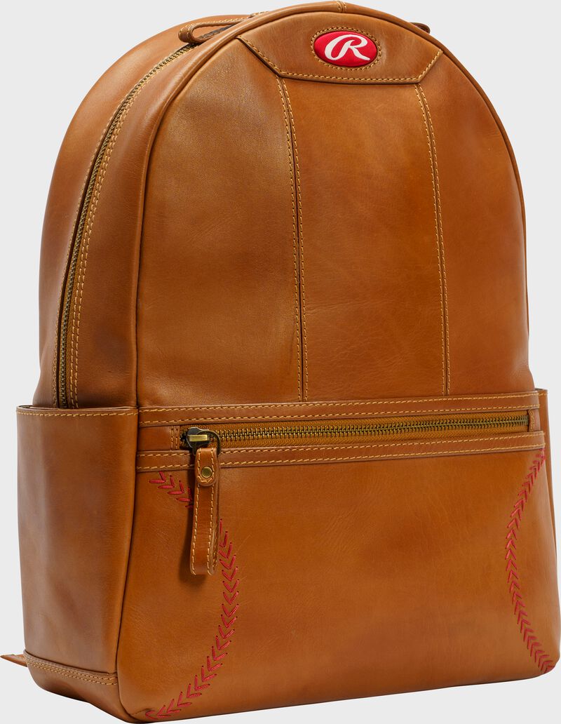Side angle view of a tan Rawlings Double Play mini backpack