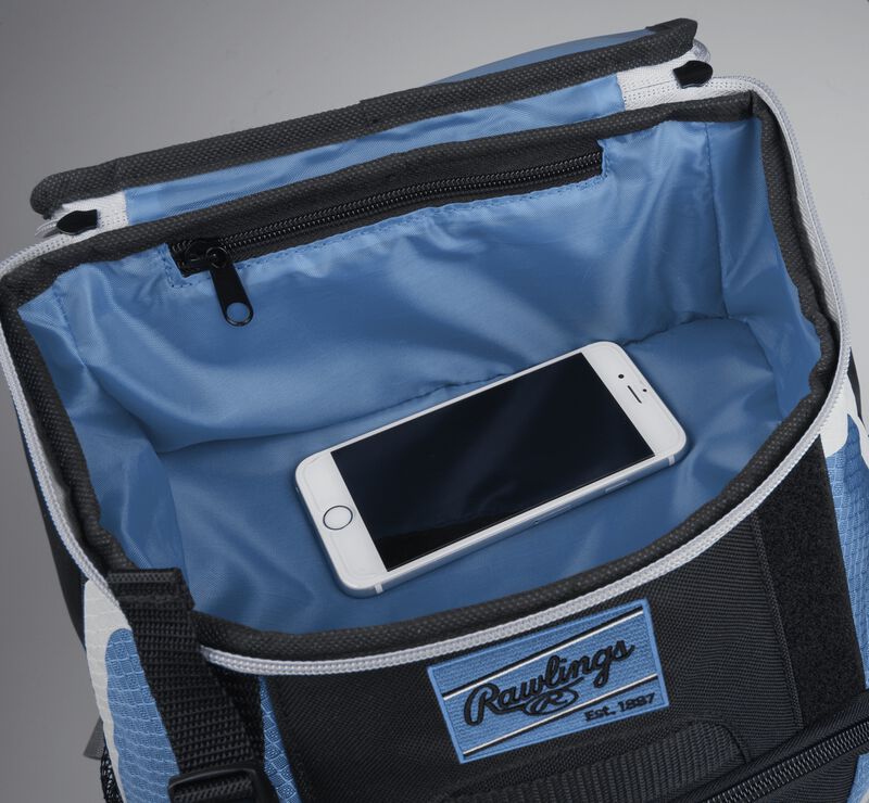 Top accessory pocket of a black/columbia blue R500 equipment backpack holding a phone