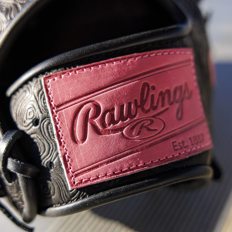 Picture of the pink leather Rawlings patch on a black Rawlings R2G Heart of the Hide 11.5" glove