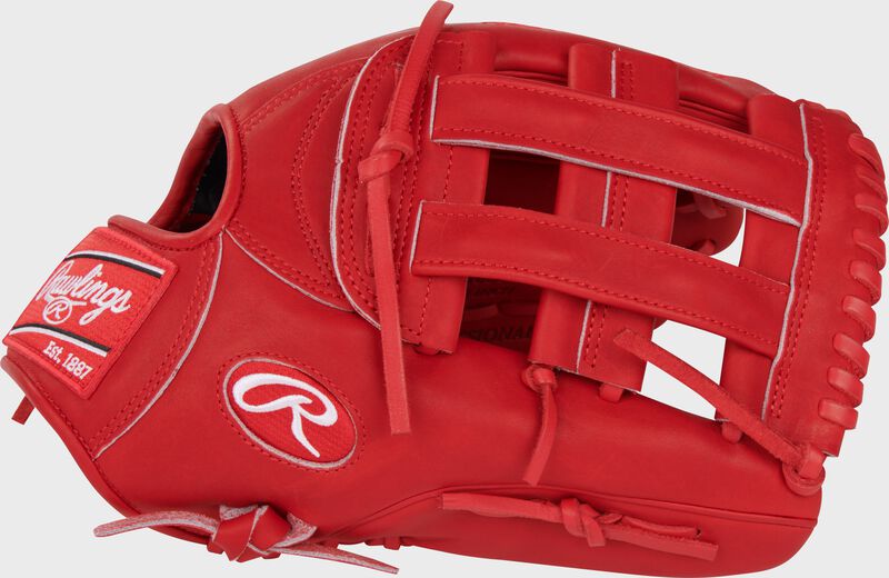 Thumb of a scarlet Corbin Carroll Heart of the Hide Outfield Glove with a scarlet H-web